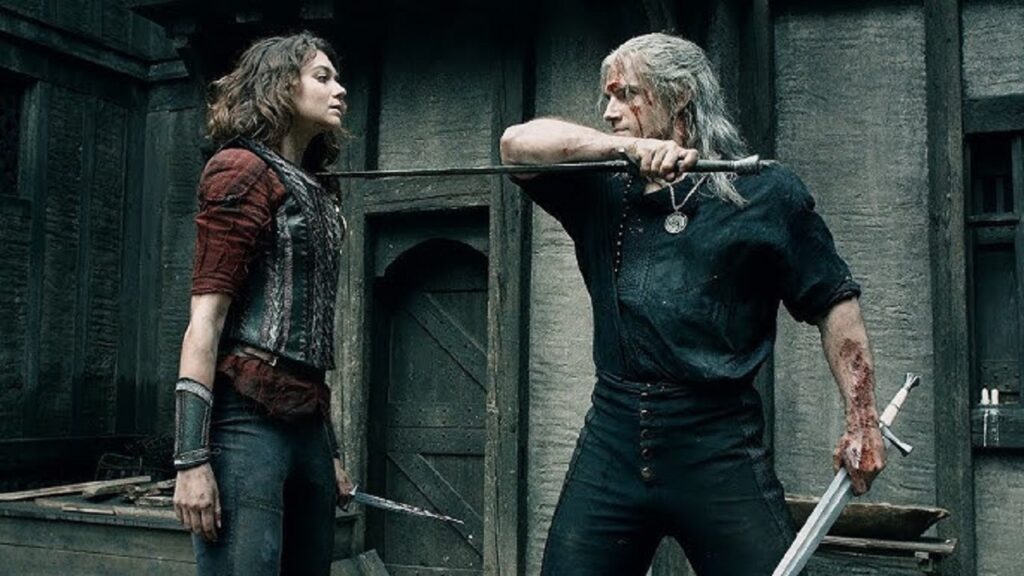Geralt amenaza con una espada a una chica en 'The Witcher'